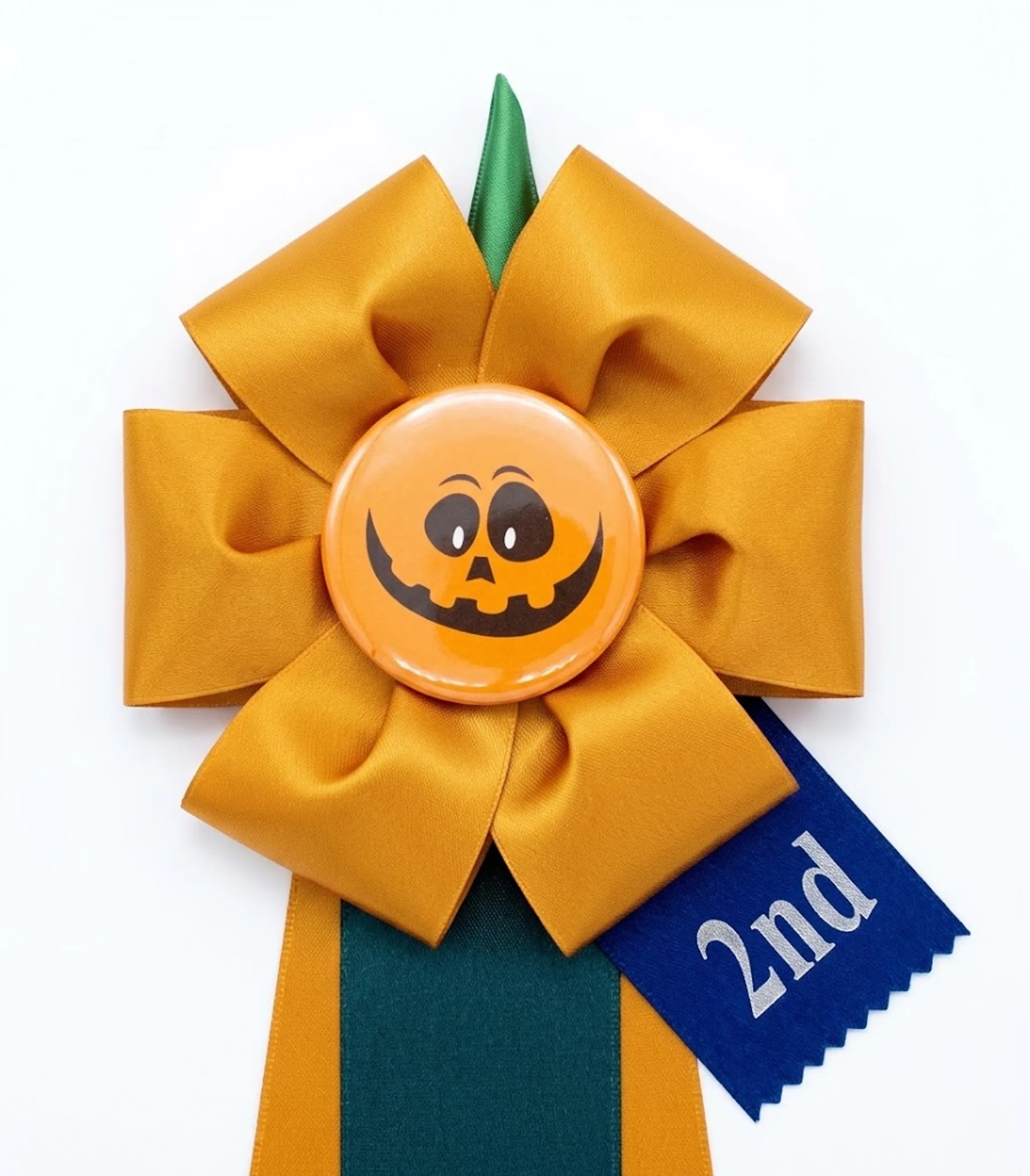 Orange pumpkin specialty rosette with jack-o-lantern badge