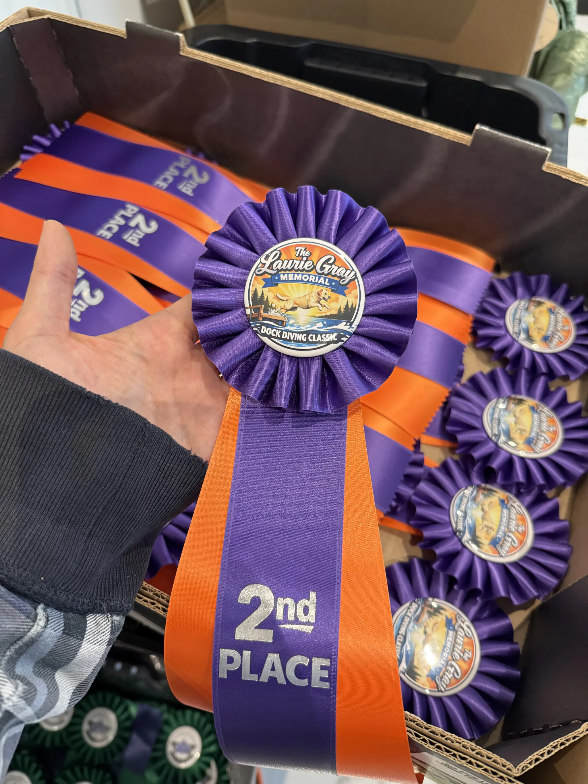 Custom branded award ribbons with event logos and badges